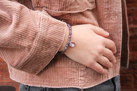 Model wearing amethyst gemstone bracelet